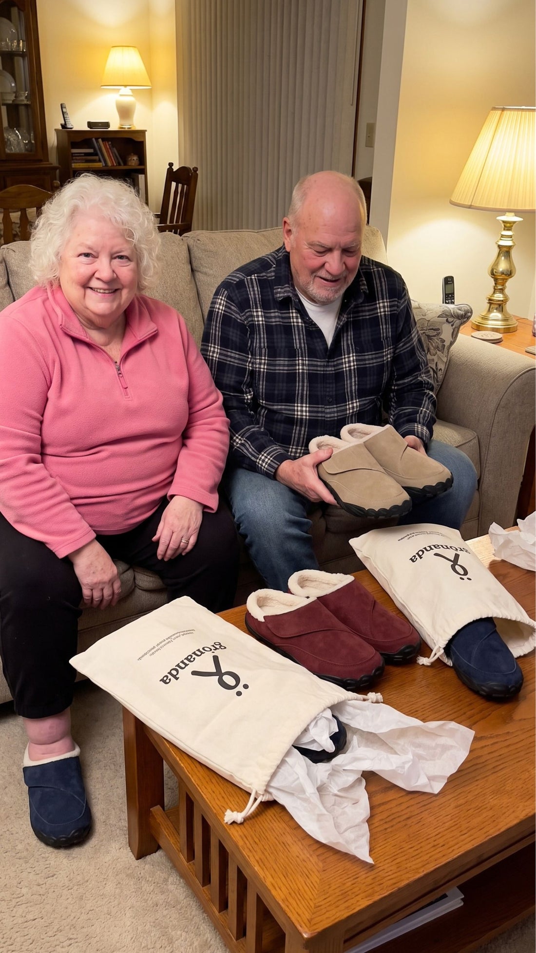 Older couple trying on a new pair of winter slippers at home